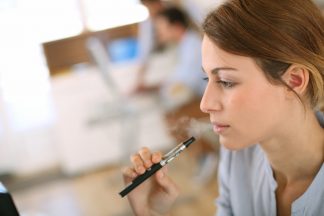 Portrait,Of,Woman,Smoking,With,Electronic,Cigarette