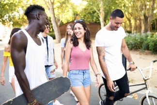 Group of active teenagers making recreational activity in an urb